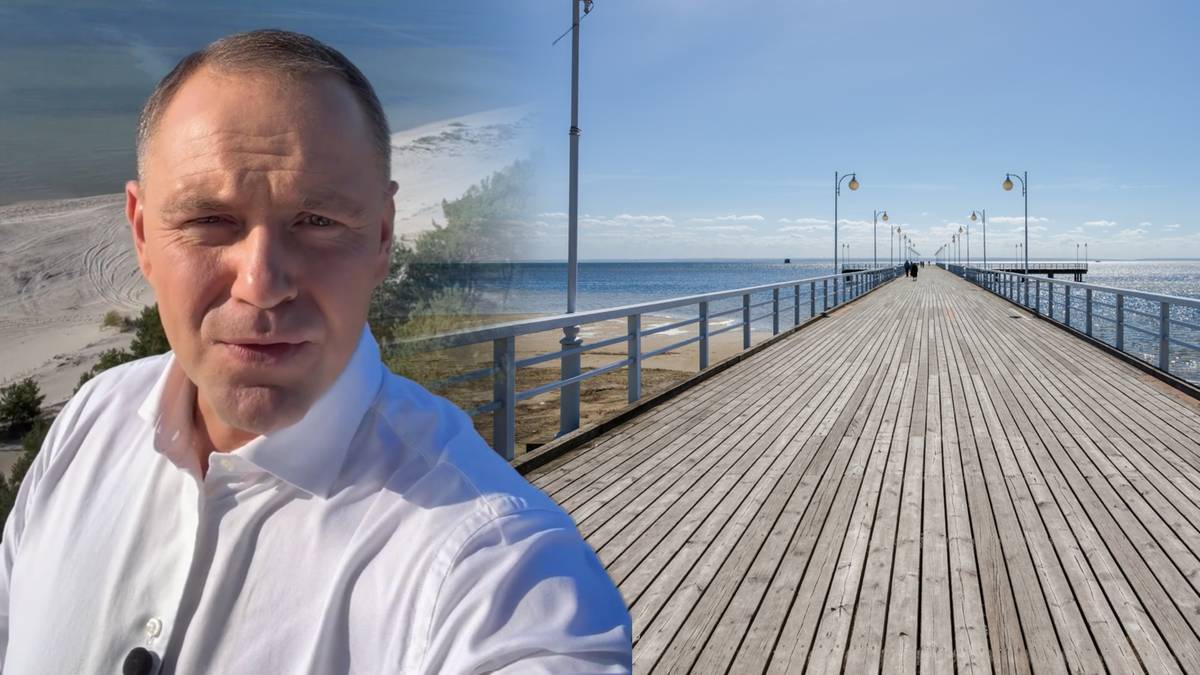 Prezydent Karol Nawrocki podczas wystąpienia, w tle nowoczesna sala konferencyjna z flagami
